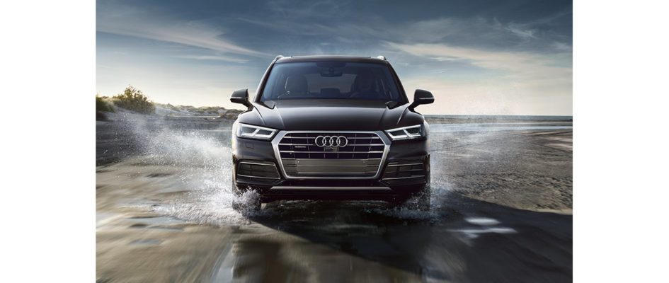 Front-facing shot of 2018 Audi Q5 driving through water