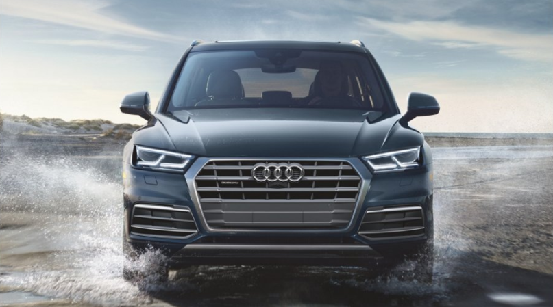 Front-facing shot of 2018 Audi Q5 driving through water