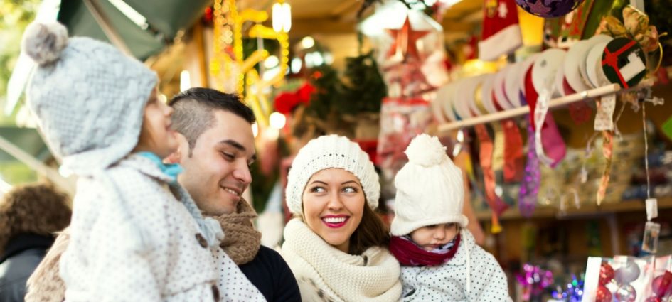 A close-up of a happy family in a blog post about NYC holiday traditions