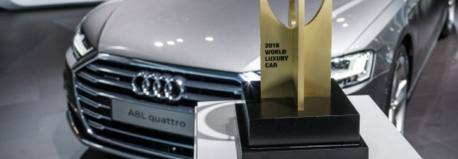 A close up of an Audi A8 L next to an award featured in a blog post about the New York International Auto Show