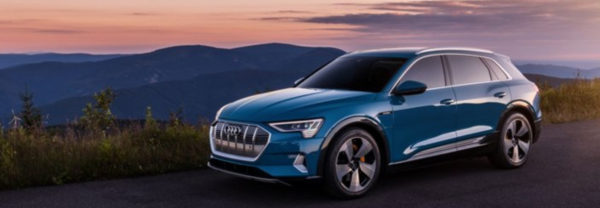 Blue 2019 Audi e-tron parked mountainside