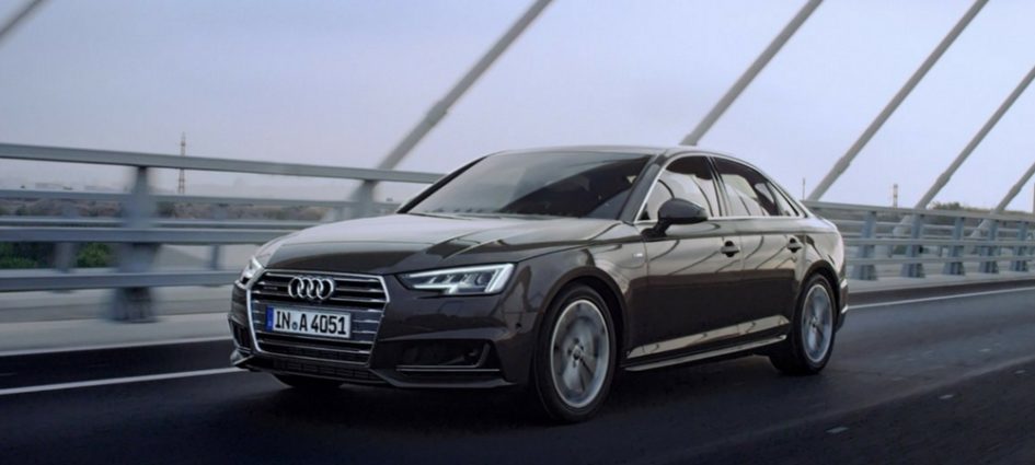 2017 Audi A4 driving down a road in a blog about Audi lease deals